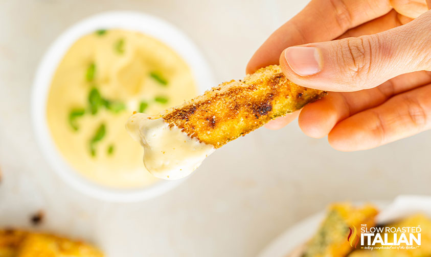 crisp keto zucchini fries dipped in sauce