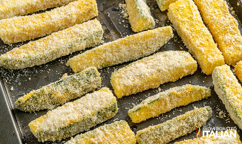 zucchini fries on a baking sheet