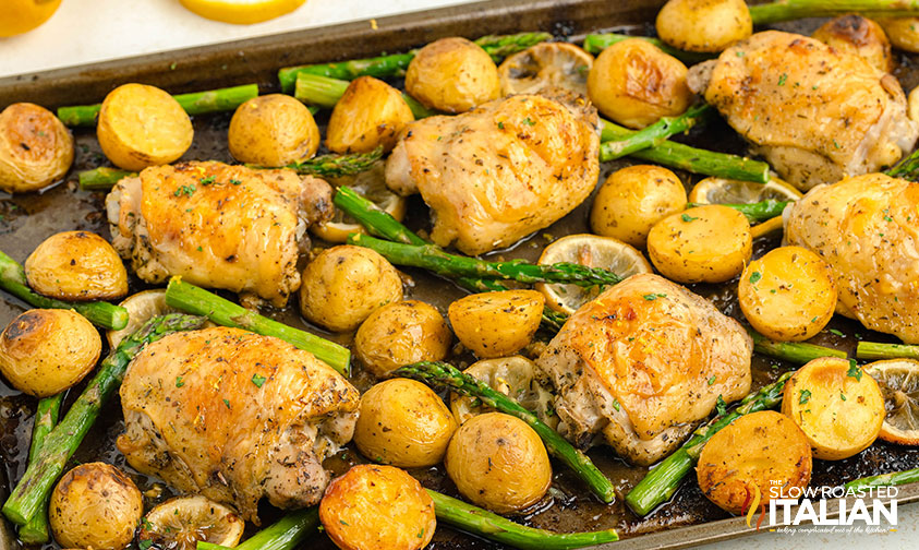 sheet pan lemon chicken baked on a baking sheet