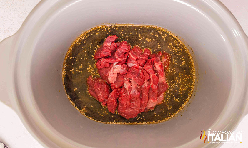 adding beef to slow cooker