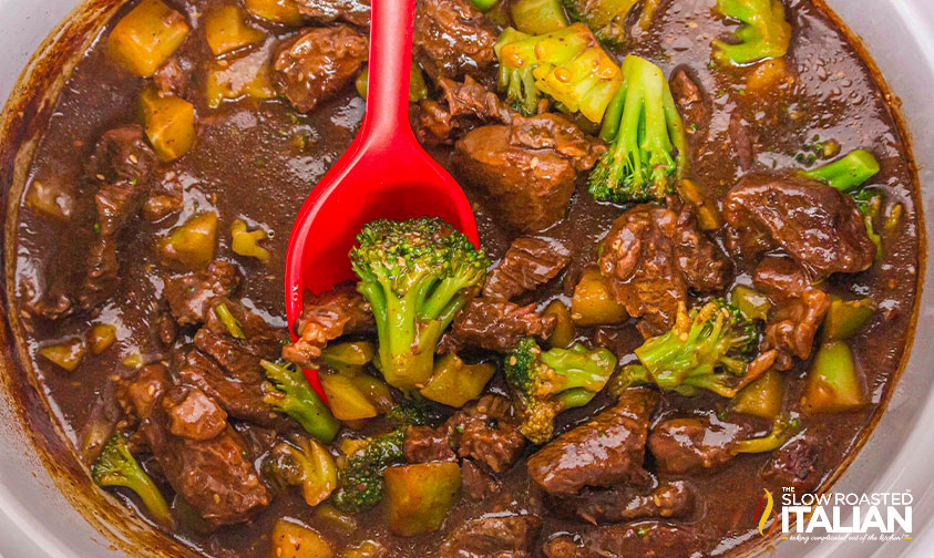 broccoli added to beef in a slow cooker