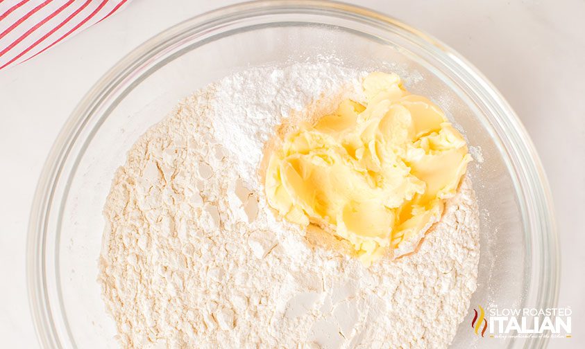 butter in bowl of dry ingredients