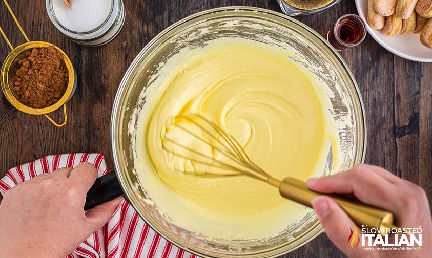 whisking mascarpone custard in bowl