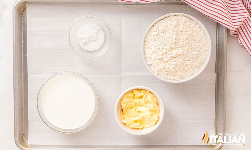 measured ingredients for no yeast bread on parchment lined baking sheet