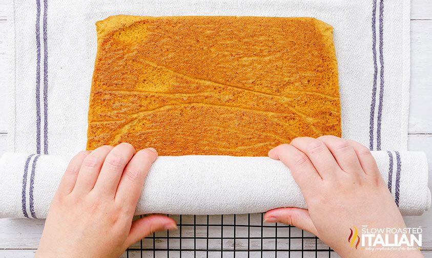 rolling sheet pan cake with tea towel