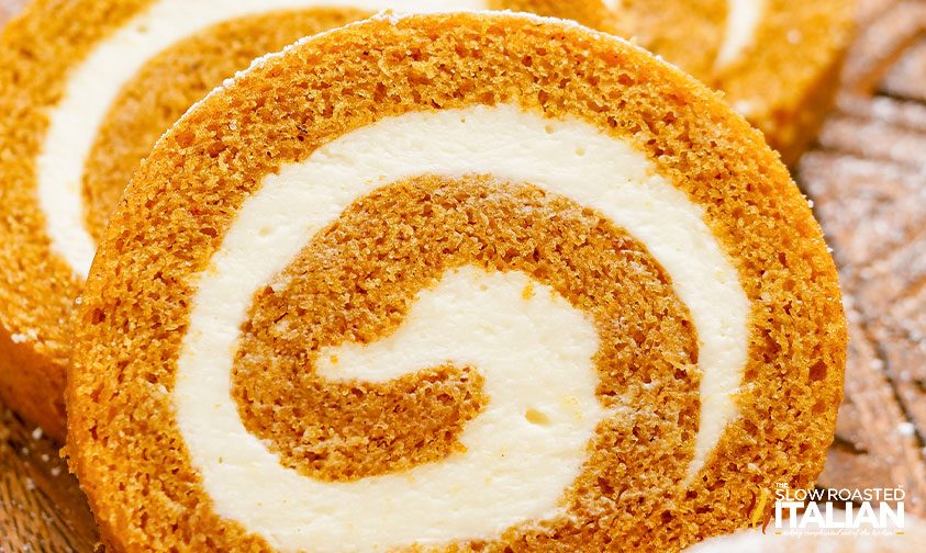 close up: pumpkin swiss roll with cream cheese frosting spiral