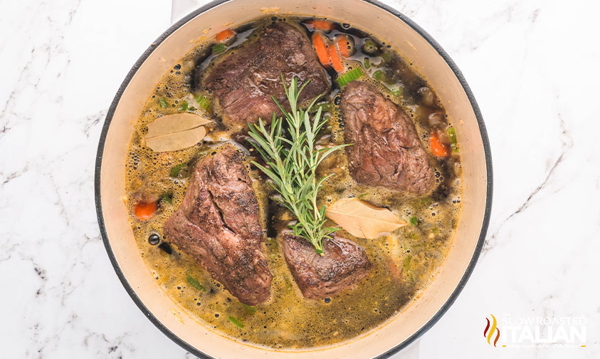 beer added to pot with short ribs