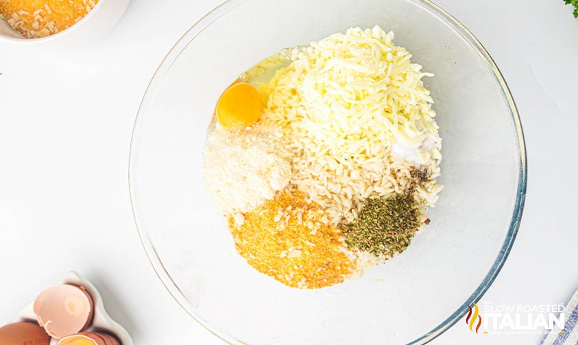 cooked rice, cheese, breadcrumbs and seasoning in a large mixing bowl