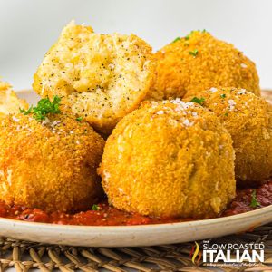 air fryer arancini on a plate with marinara