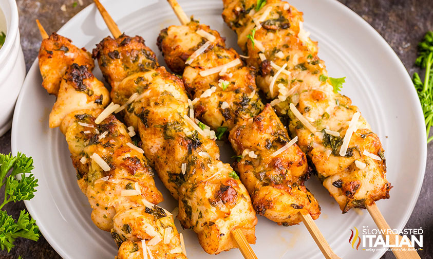 four air fryer chicken skewers on a plate