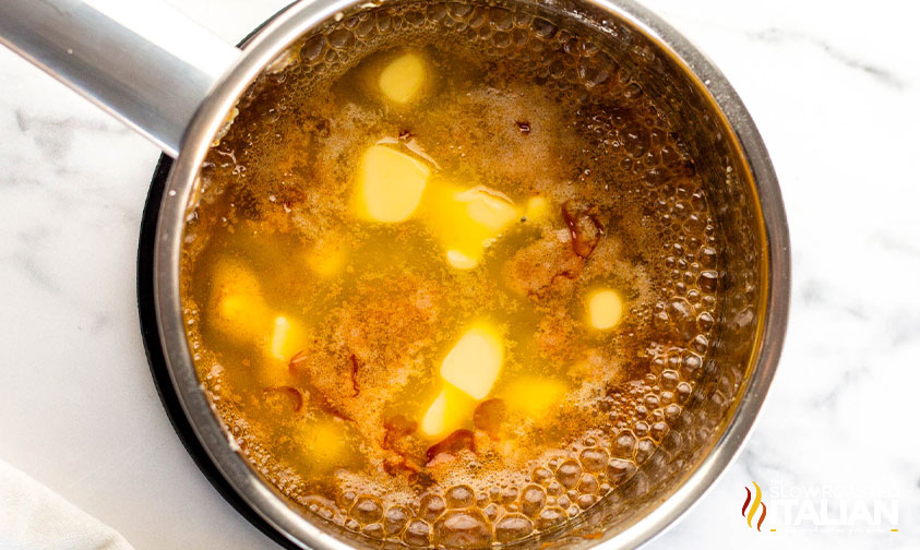 adding butter to sauce pan