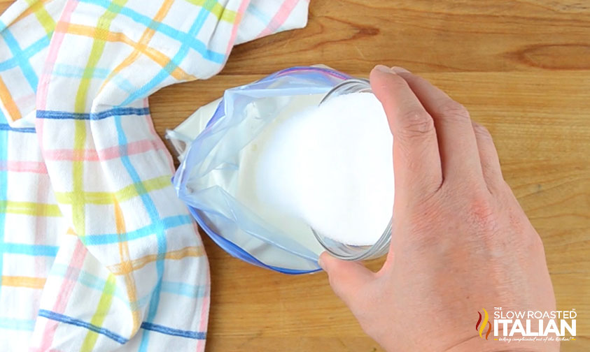 adding granulated sugar to ice cream mixture