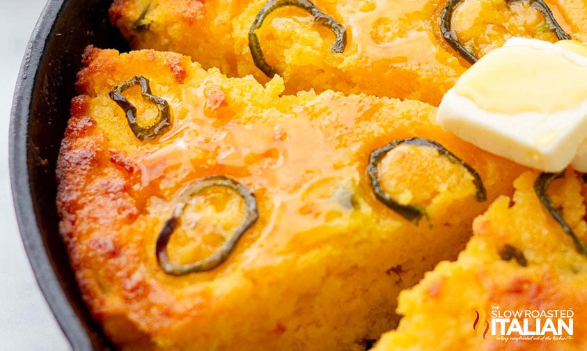 sliced jalapeno cornbread in a cast iron skillet