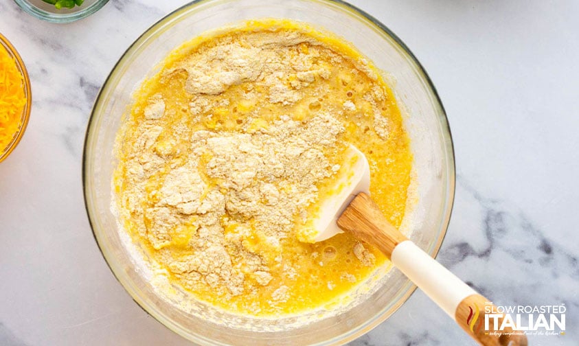 adding melted butter, eggs and buttermilk to dry ingredients