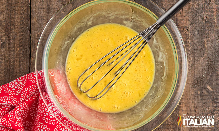 whisked eggs in a large mixing bowl