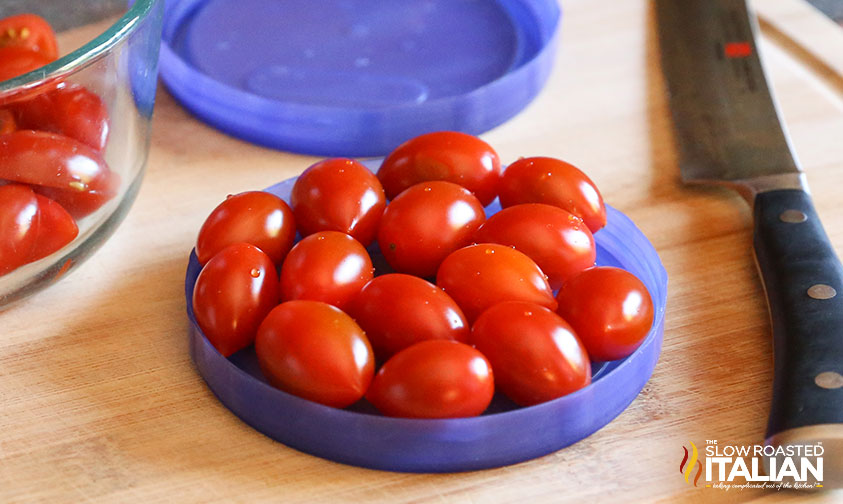 handful of cherry tomatoes on a lid