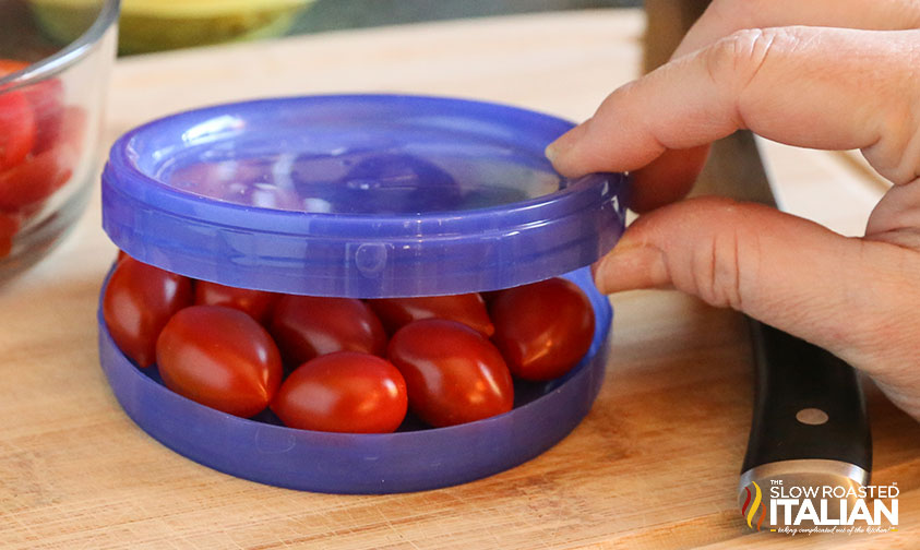 placing second lid on top of cherry tomatoes