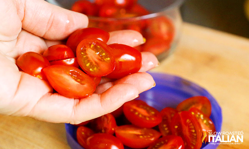 hand full of perfectly sliced cherry tomatoes