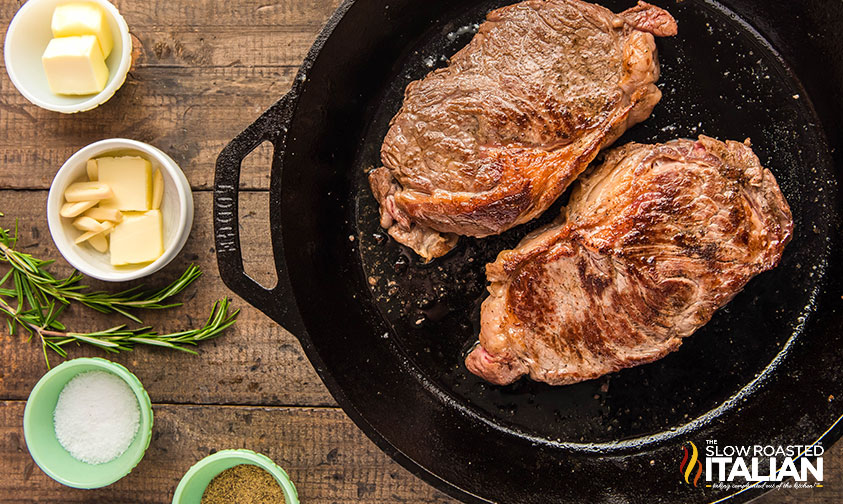 ribeye steaks in a cast iron skillet