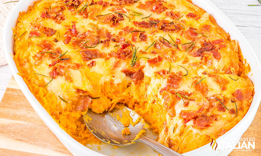 savory sweet potato casserole with a serving spoon