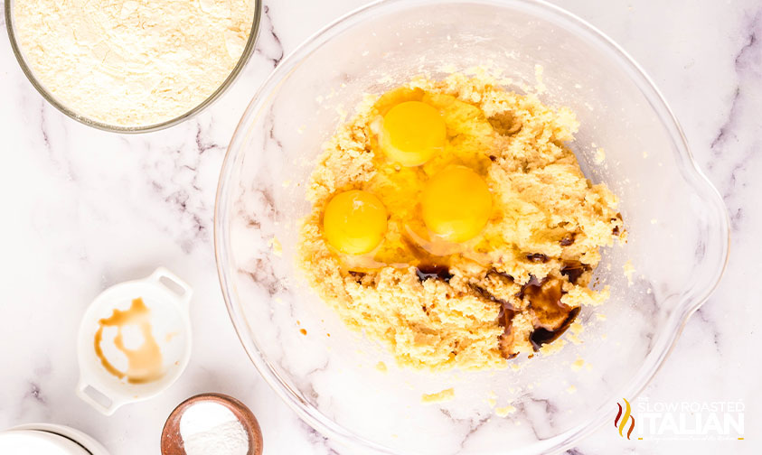 adding eggs to creamed butter and sugar