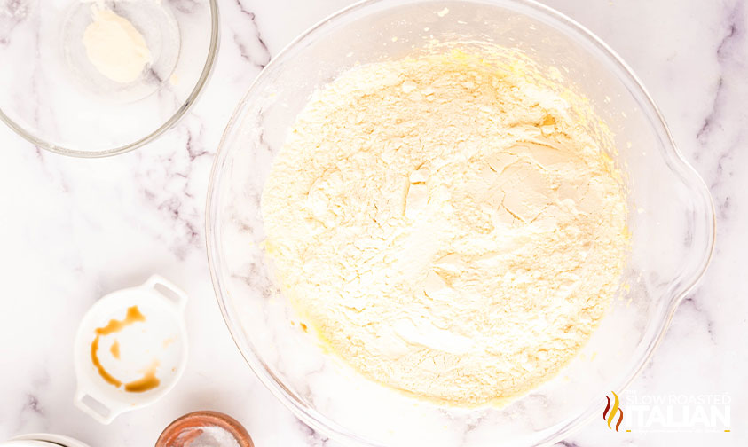 adding dry ingredients to cookie dough