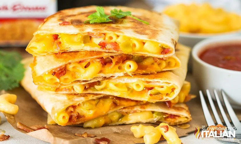 bacon mac and cheese quesadilla slices stacked on top of each other