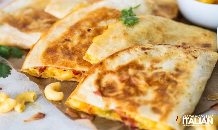 close up: mac n cheese quesadilla cut into quarters