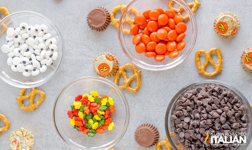 bowls of candies and sprinkles to make turkey pretzel treats