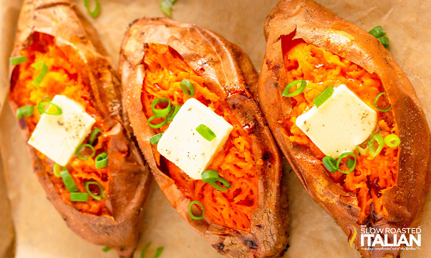 butter and herbs on baked sweet potatoes