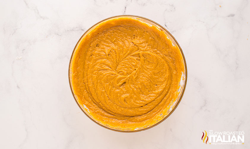 mixed pumpkin muffin batter in a mixing bowl