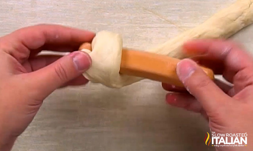 wrapping hot dog in pretzel dough