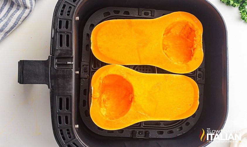 sliced butternut squash in air fryer basket