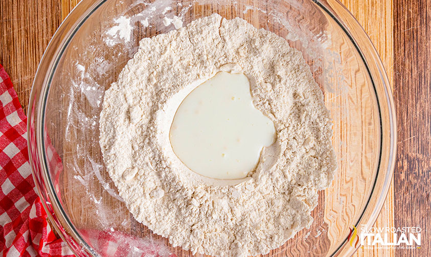 adding buttermilk to well in flour mixture