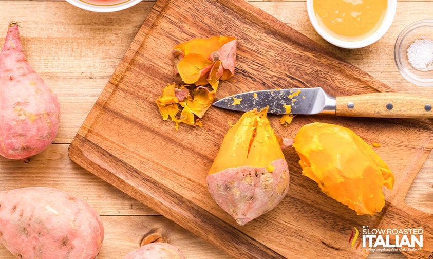 peeled sweet potato on a cutting board