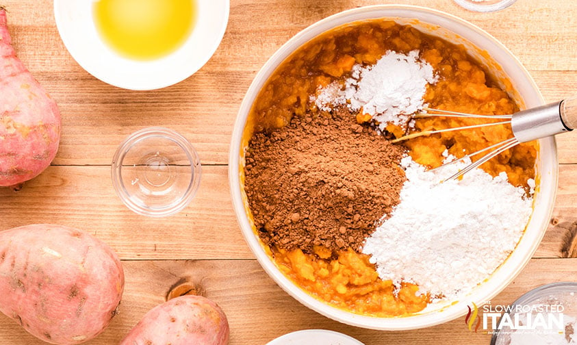 ingredients for sweet potato brownies in a large mixing bowl