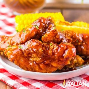 closeup of honey chipotle chicken crispers on a plate with sides