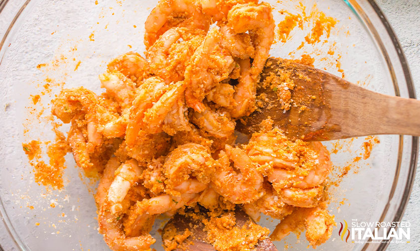 bread crumbs and parmesan cheese added to shrimp in large mixing bowl