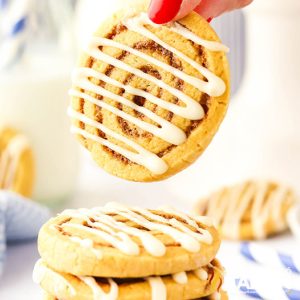 hand holding a cinnamon roll cookie