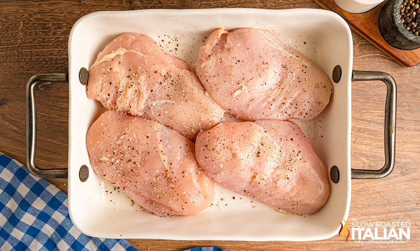 seasoned chicken breasts in a baking dish