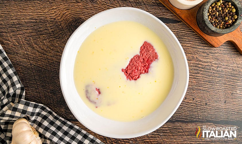 cubed steak in buttermilk egg mixture