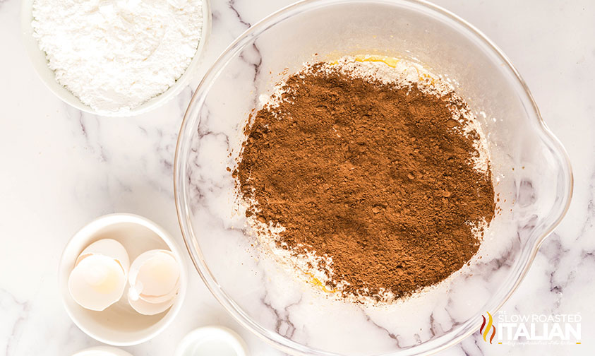 adding cocoa to flour and butter mixture