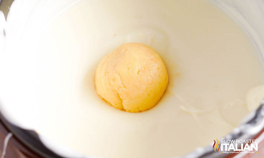 golden oreo truffle dipped in white almond bark