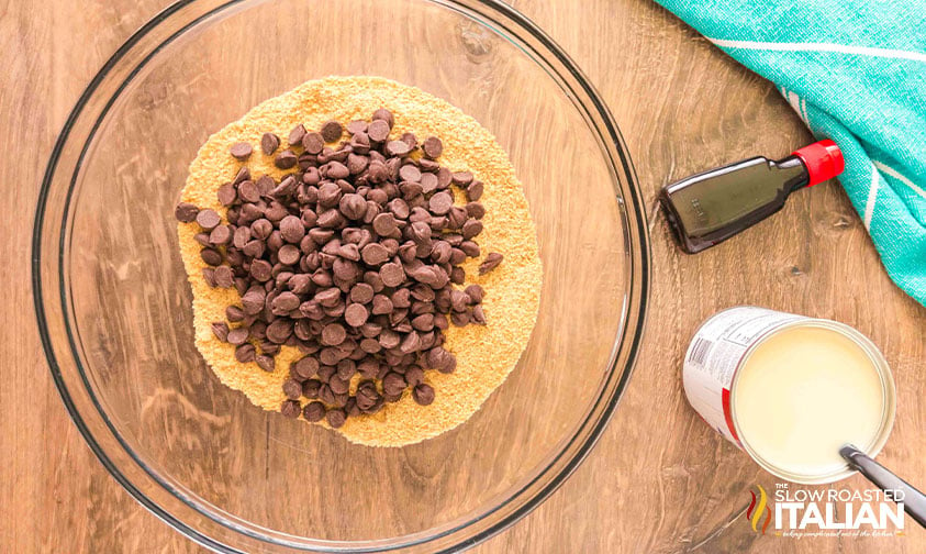 crushed graham crackers and chocolate chips added to mixing bowl