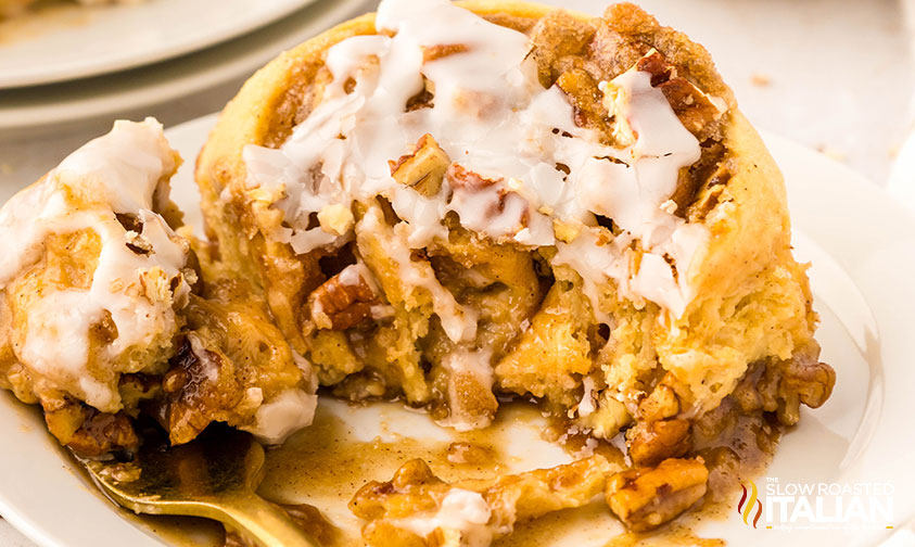 closeup of maple cinnamon rolls with pecans