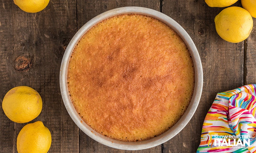 baked lemon cream cake in a round baking pan