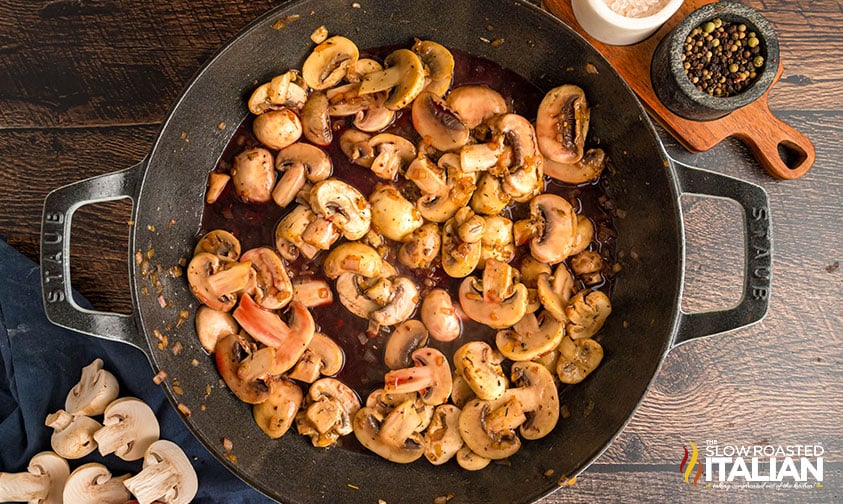 adding mushrooms to cast iron pan