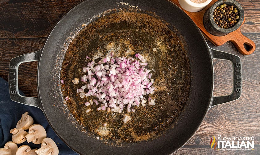 shallots added to cast iron pan