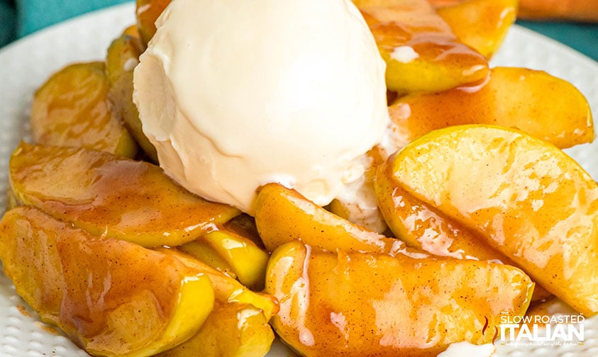 cracker barrel fried apples on a plate with a scoop of ice cream