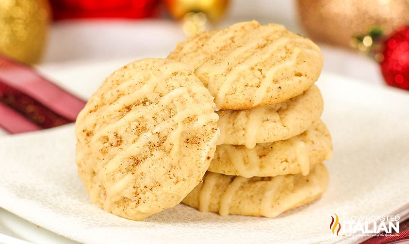 closeup of eggnog cookies stacked on a plate